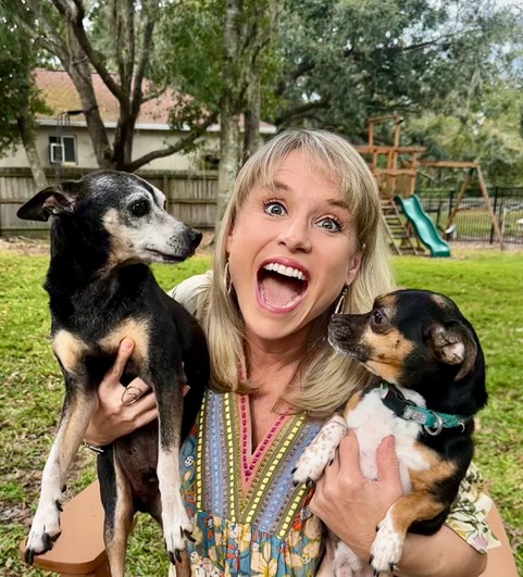 Kelly Diedring Harris holding her two dogs